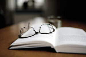 book and a pair of glasses